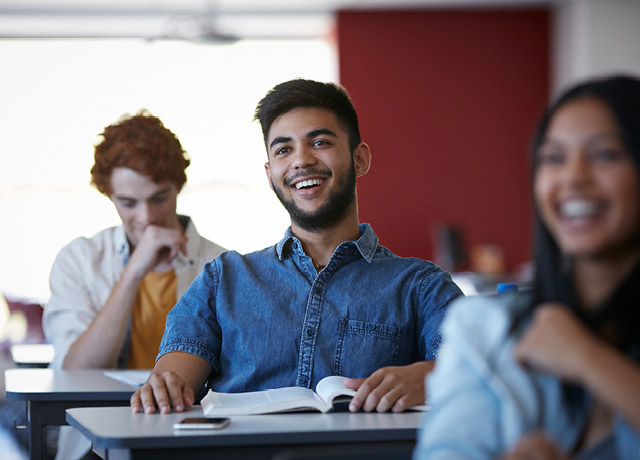 Smiling student in a classroom