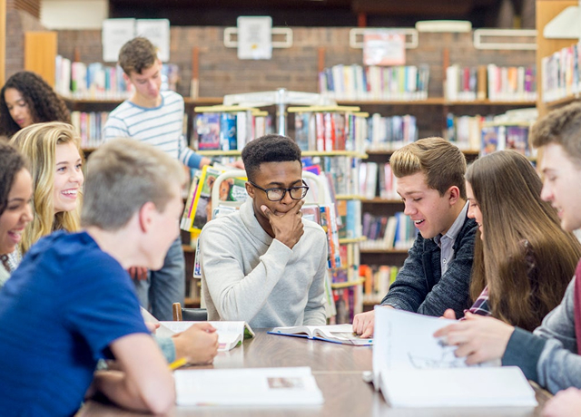 Students studying together in a library setting