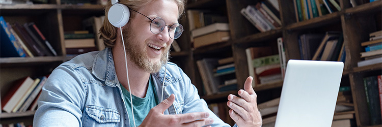 Man with headphones teaching online