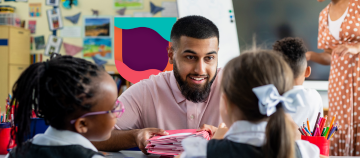 Teacher interacting with young learners in a classroom.