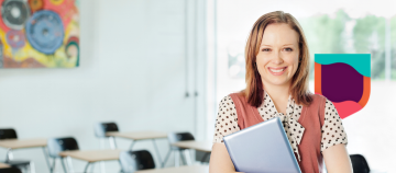 Person holding a folder in a classroom