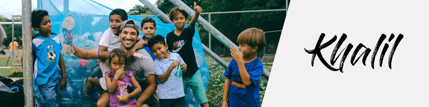 khalil with children and plastic bottle