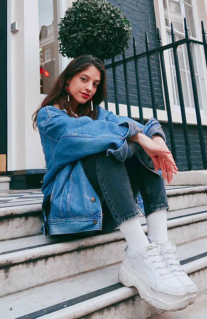 luana sitting on steps