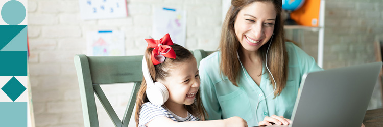 young learner with parent on laptop