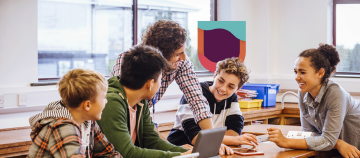 Teacher guiding students during a group activity.