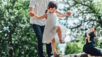 parents and child playing