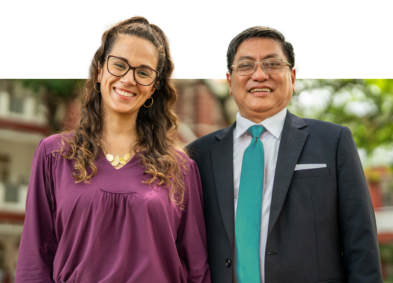 Two educators smiling outdoors, representing trusted teaching support