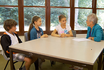 Three children playing a vocabulary memory game