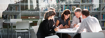 Five colleagues having a meeting in English