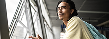Male student at an airport.