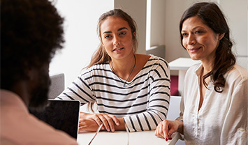 student with parent and teacher