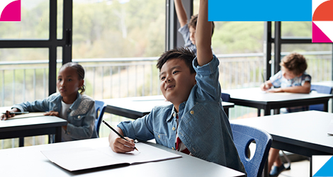 young student putting his hand up in class