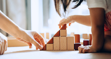 child with building blocks