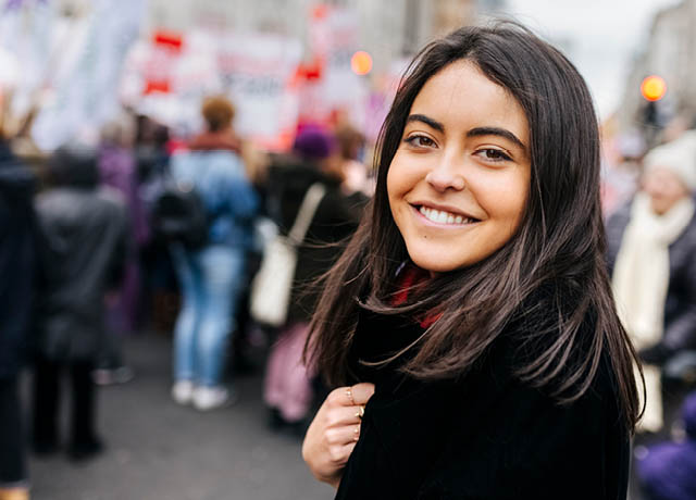 Female student at a meeting outside